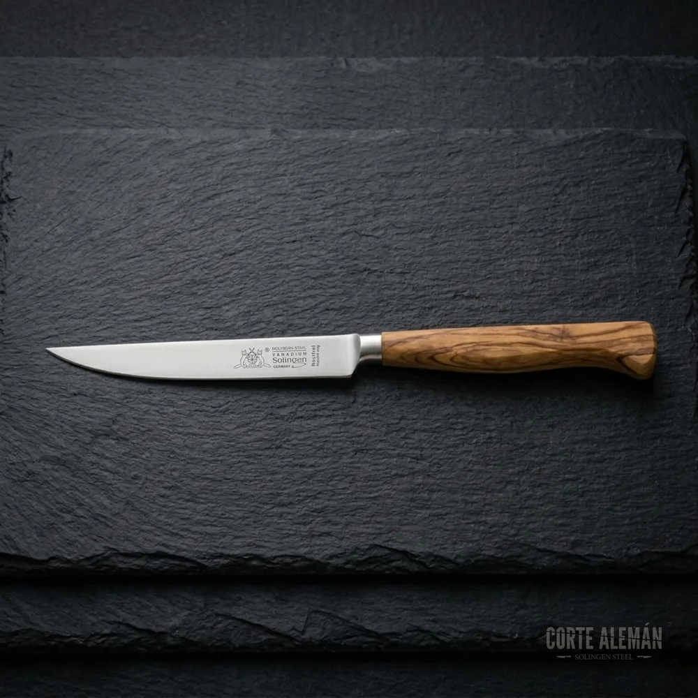 Cuchillo para steak parrilladas marca Max Melchior de Solingen Alemania con fondo oscuro